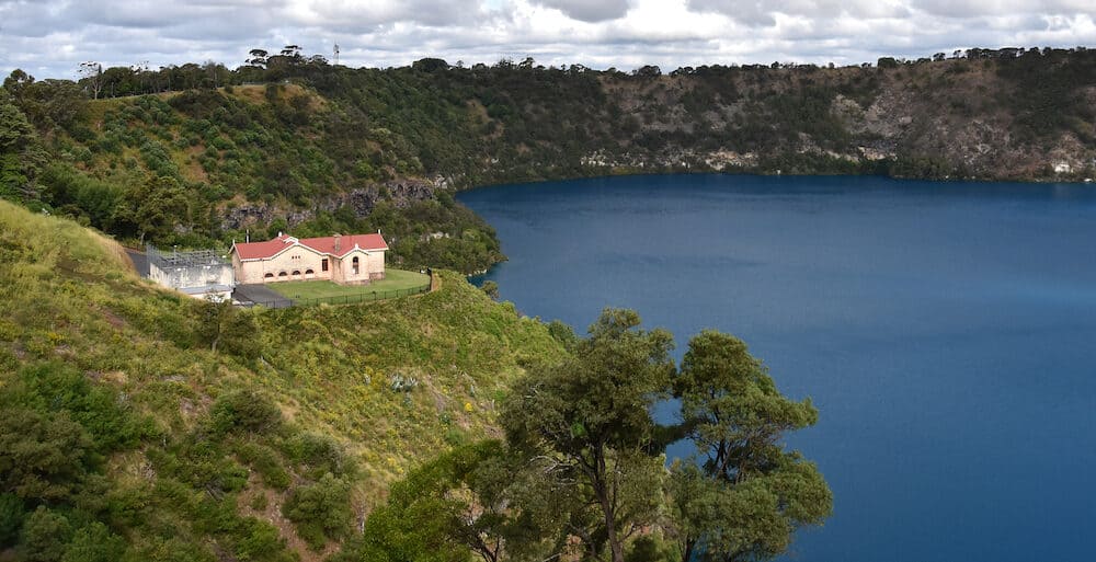 The incredible Blue Lake with the original pumping station at Mt Gambier South Australia. The Blue Lake is a large monomictic crater lake located in a dormant volcanic maar associated with the Mount Gambier maar complex.