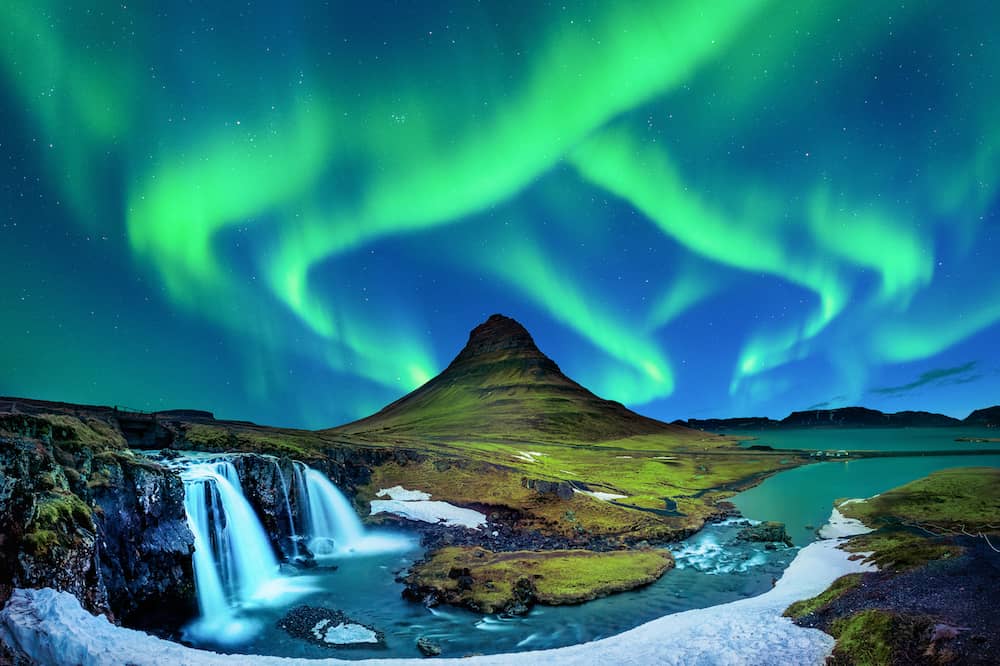 Northern Light, Aurora borealis at Kirkjufell in Iceland. Kirkjufell mountains in winter.