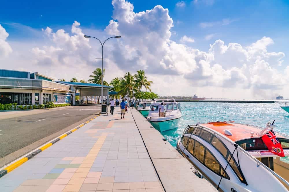 MALE, MALDIVES - Boats at the harbor next to Ibrahim Nasir International Airport in Male, Maldives.