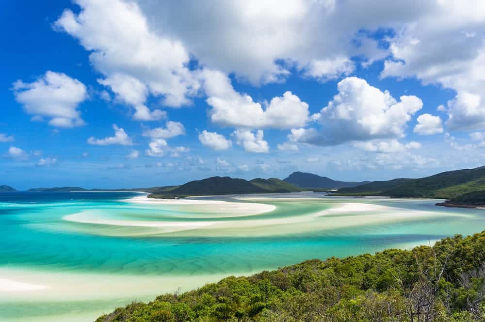 Tropical beach paradise background of turquoise blue water and Coral sea beach. Aerial Whitehaven beach and Hill inlet estuary