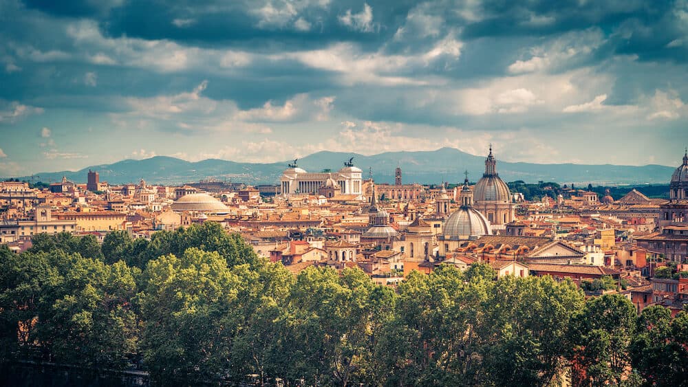 Aerial panoramic view of Rome in summer, Italy. Rome skyline. Old Rome in the sunlight. Beautiful scenic panorama of Rome on a sunny day. Vintage photo.