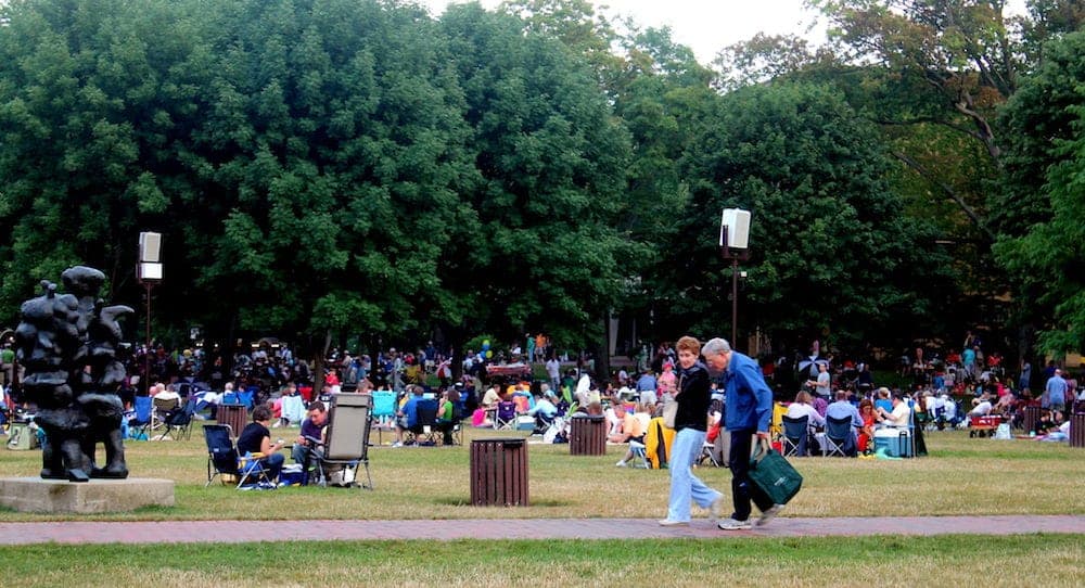 HIGHLAND PARK,ILLINOIS People settling in on the lawn getting ready to the concert circa at the world famous Ravinia music festival in Highland Park,Illinois