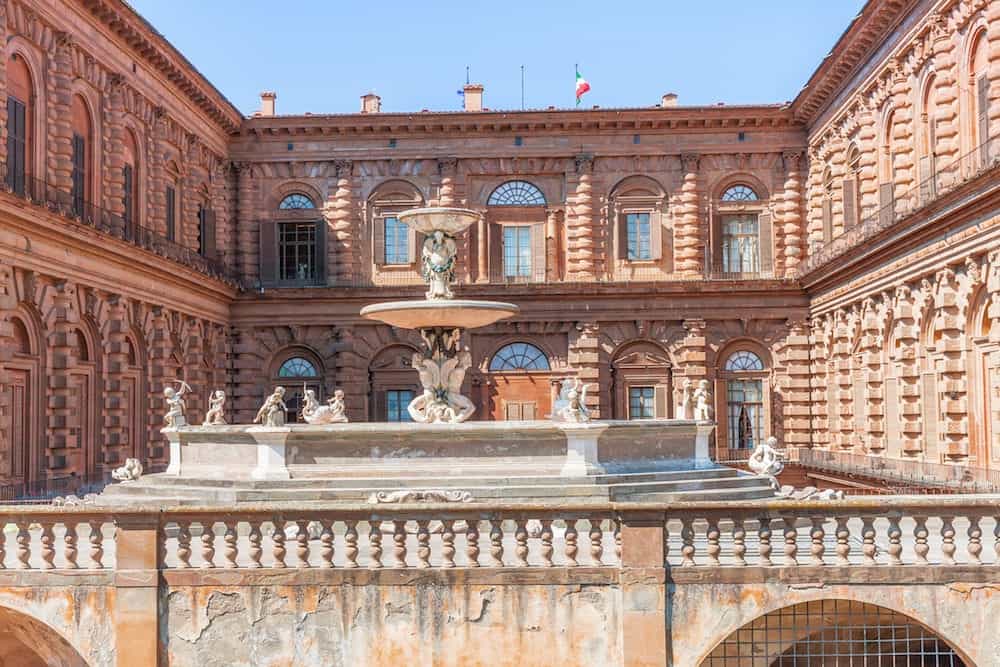 The facade of Palazzo Pitti and the fountain Florence in Italy
