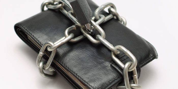Locked wallet with chain and padlock save money concept