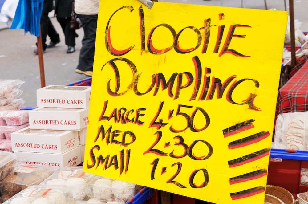 Stall selling clootie dumpling traditional Scottish food at the Barras market Glasgow.