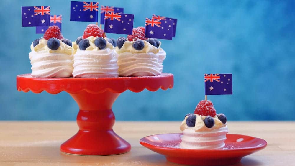 Australian mini pavlovas and flags in red, white and blue for Australia Day or national holiday party food treats.