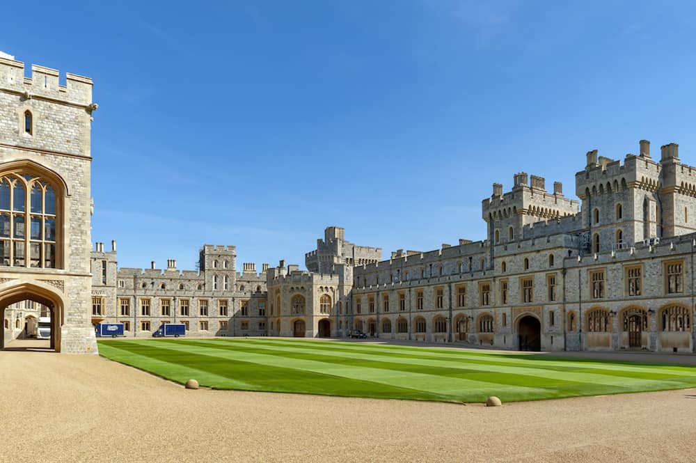 Windsor, UK Group of buildings including Private Apartment, State Apartment, and South Wing with King Charles II Statue at The Upper Ward and The Quadrangle of Windsor Castle, a royal residence at Windsor in county of Berkshire, England, UK
