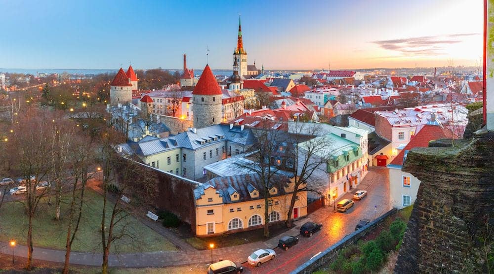 Aerial panoramic cityscape with Medieval Old Town, St. Olaf Baptist Church and Tallinn City Wall in the morning, Tallinn, Estonia