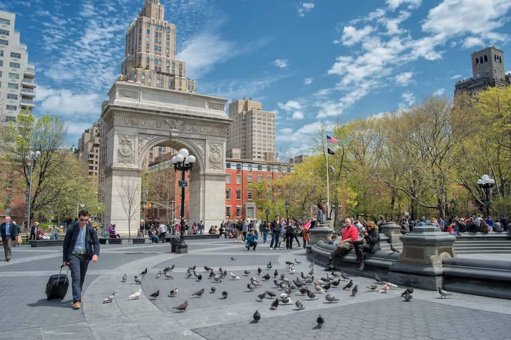 NEW YORK CITY, USA - People enjoying a sunny spring day in Washington Square Park. This is an iconic park and a center for cultural activity in Greenwich Village.