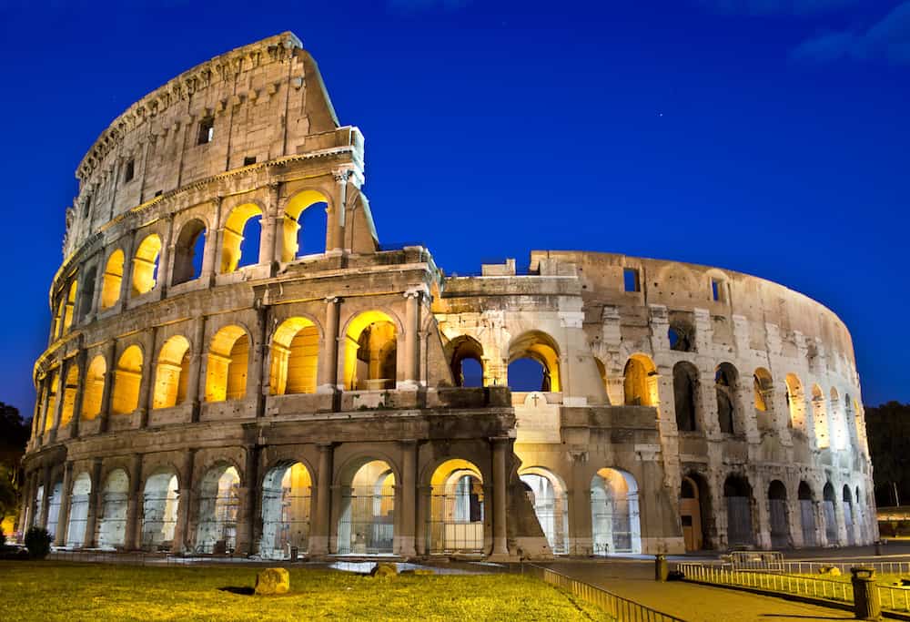 Ancient roman colosseum at dusk Rome Italy