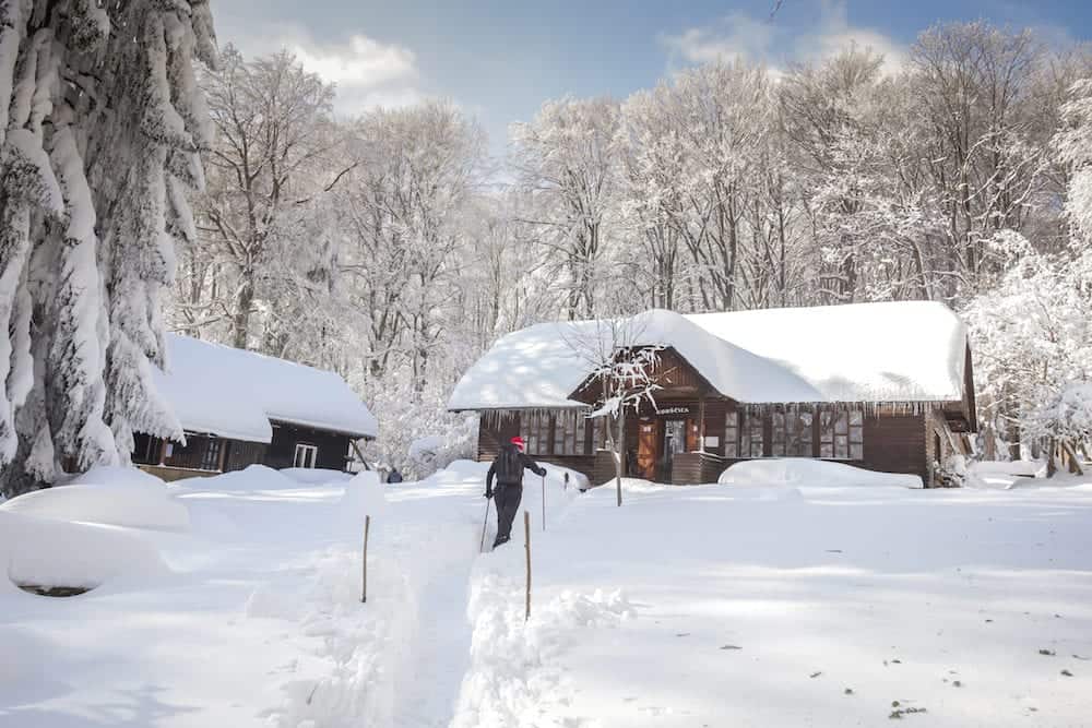 ZAGREB, CROATIA - : Hiker walking to the mountain hut Gorscica on the Sljeme mountain near Zagreb, Croatia.