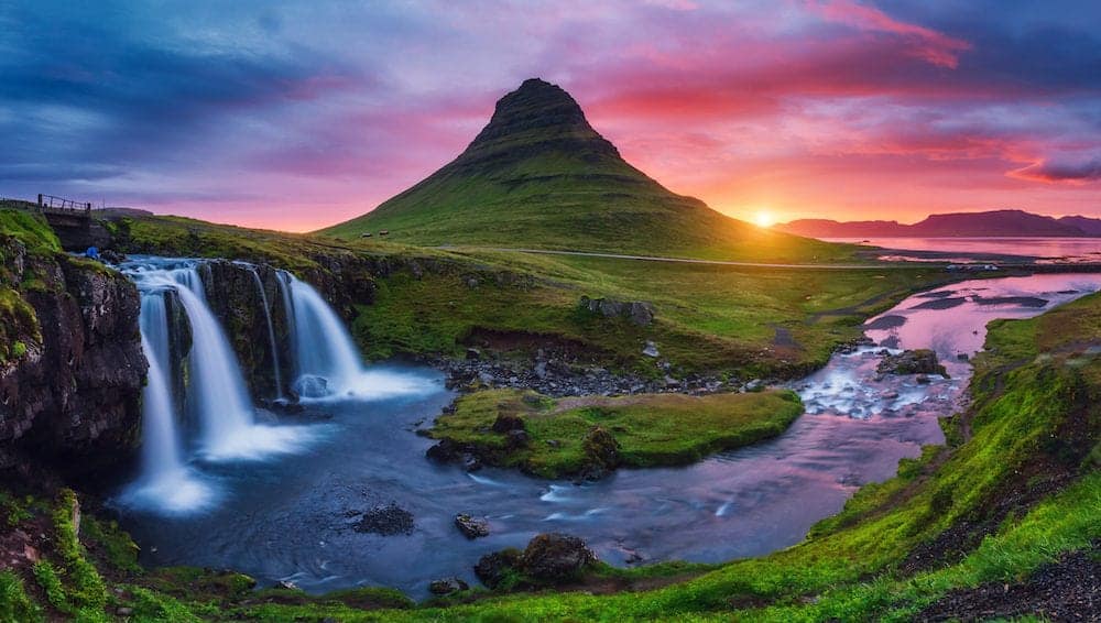 Majestic evening with Kirkjufell volcano the coast of Snaefellsnes peninsula. Dramatic and picturesque scene. Location famous place Kirkjufellsfoss waterfall, Iceland, Europe. Beauty world.
