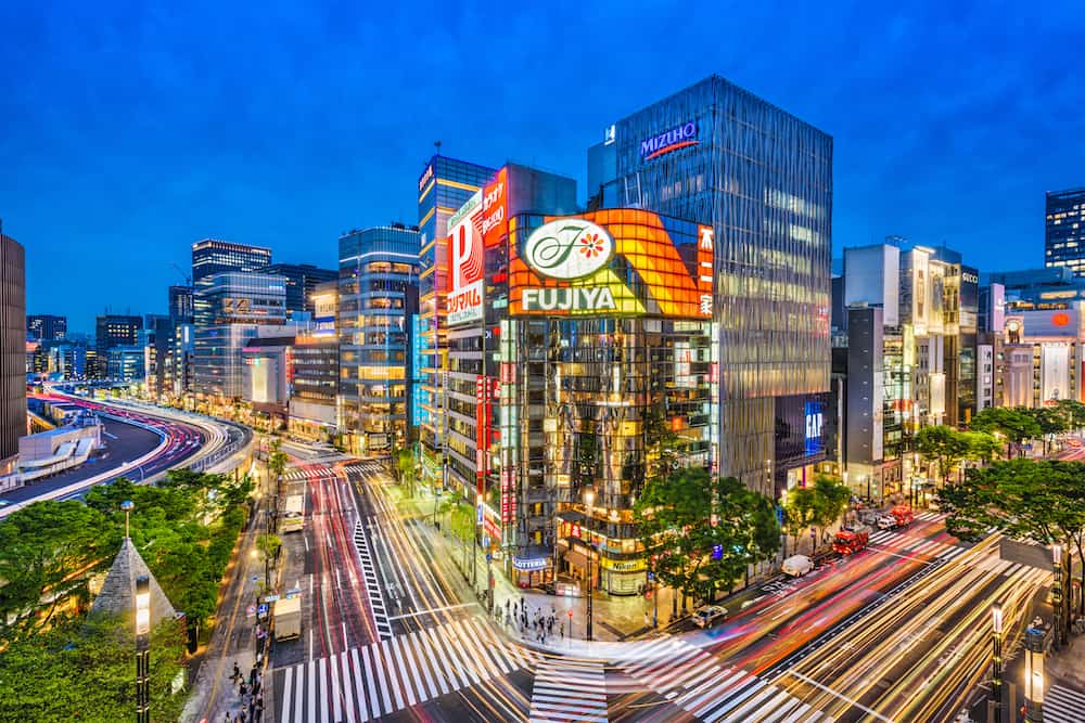 TOKYO, JAPAN - : The Ginza district at night. Ginza is a popular upscale shopping area of Tokyo.