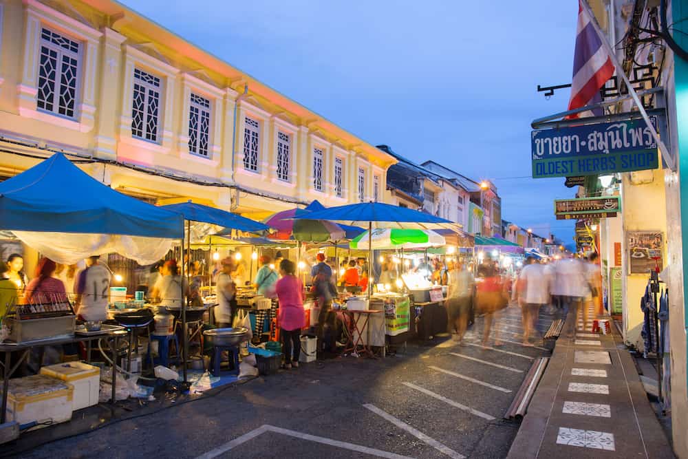 PHUKET THAILAND MAY 29 2016: Tourists shop at night market of Phuket on May 29 2016.among old building Chino Portuguese style street of Phuket town is the famous Phuket and is a major tourist hub.