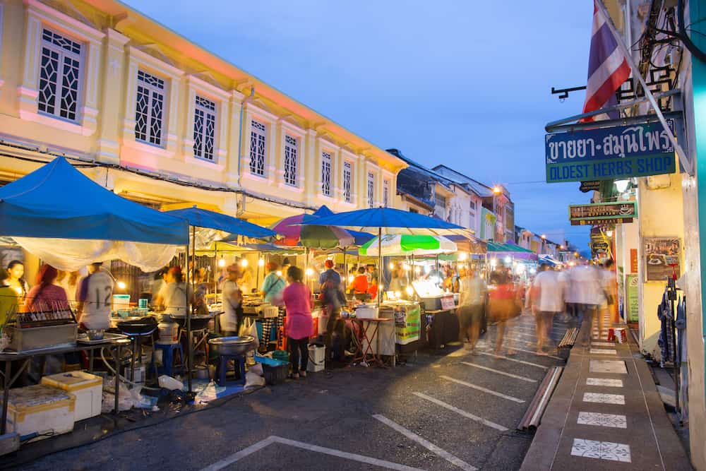 PHUKET THAILAND MAY 29 2016: Tourists shop at night market of Phuket on May 29 2016.among old building Chino Portuguese style street of Phuket town is the famous Phuket and is a major tourist hub.