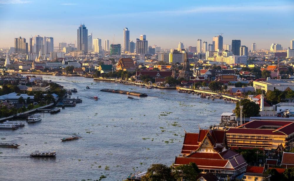 Bangkok City and chaopraya river in twilight time Hotel and resident area in the capital of Thailand
