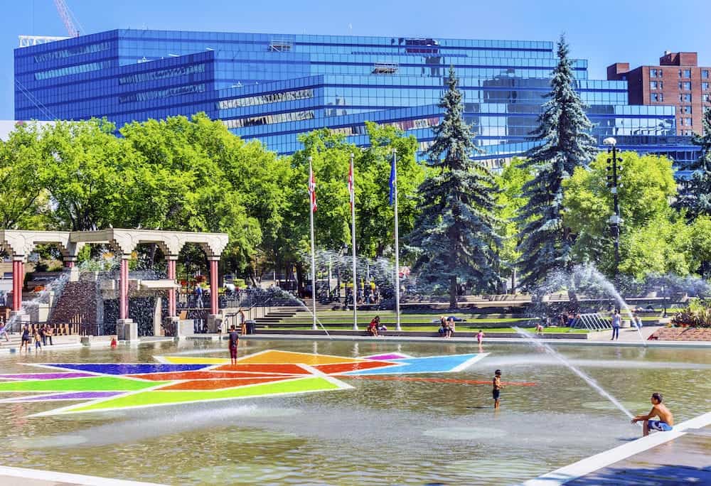 CALGARY, ALBERTA, CANADA - Children Playing Olympic Plaza Fountains Summer Downtown Calgary Alberta Canada. Olympic Plaza was created in 1988 for Olympic Winter Games.