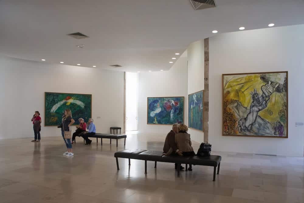 Nice France -Tourists look at the paintings by Marc Chagall in Marc Chagall Museum Nice France.