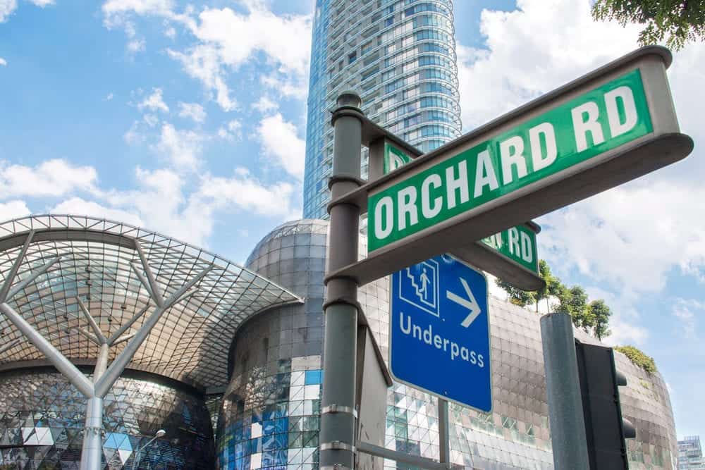 SINGAPORE - : Street sign or traffic sign of Orchard Road with underpass sign for tourist. The famous shopping main street Orchard Road area in Singapore.