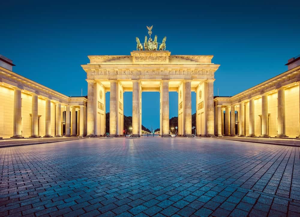 Classic view of famous Brandenburger Tor (Brandenburg Gate) one of the best-known landmarks and national symbols of Germany in twilight during blue hour at dawn Berlin Germany