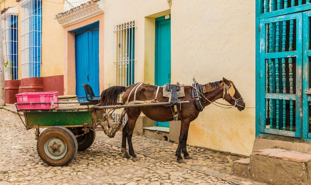 Trinidad, cuba. A view of a horse and cart in a colourful street in Trinidad in Cuba