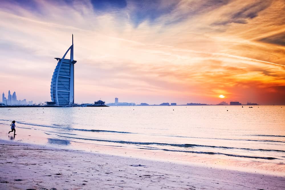 DUBAI, UAE -:The world's first seven stars luxury hotel Burj Al Arab at sunset seen from Jumeirah public beach in Dubai, United Arab Emirates