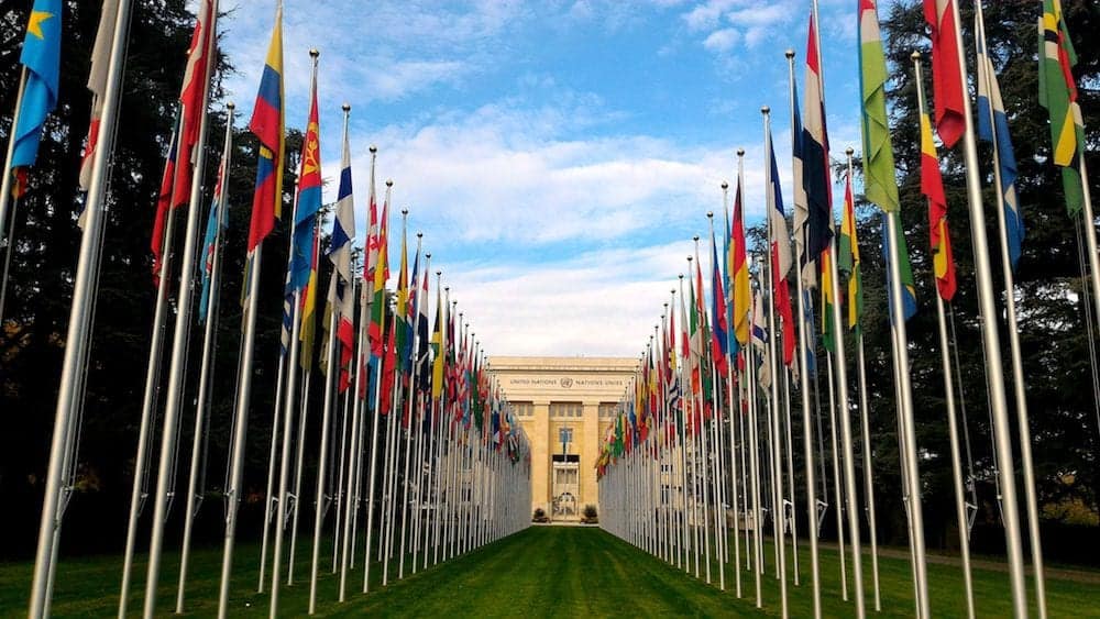 GENEVA, SWITZERLAND - : National flags at the entrance in UN office at Geneva, Switzerland . The United Nations was established in Geneva in 1947 and is the second largest UN office.