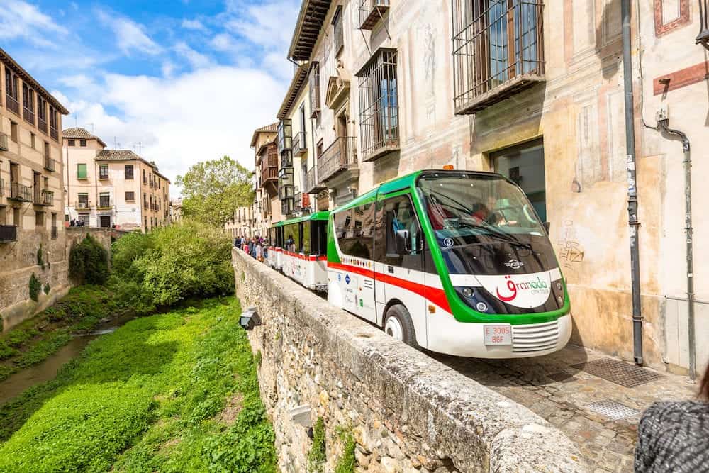 Granada, Andalucia, Spain Granada City Tour with the shuttle along the Carrera del Darro in the popular old Moorish Albaicin quarter. It's located on a hill facing the Alhambra.