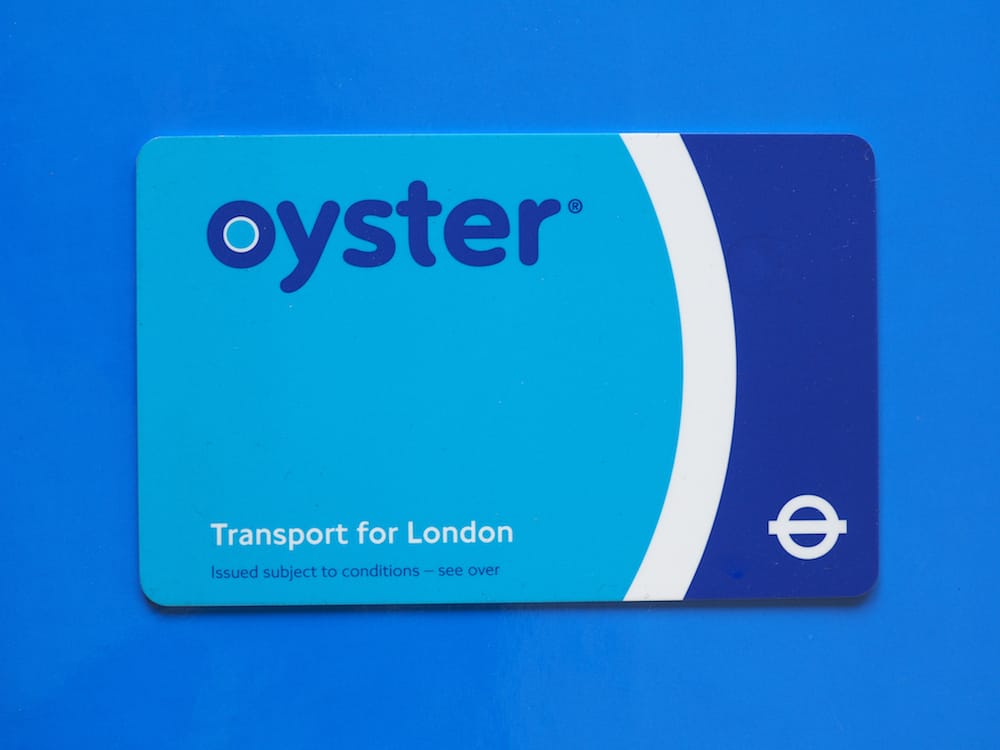 LONDON UK - CIRCA The Oyster Card uses near field communication technology for public transport ticketing in and around London over blue background