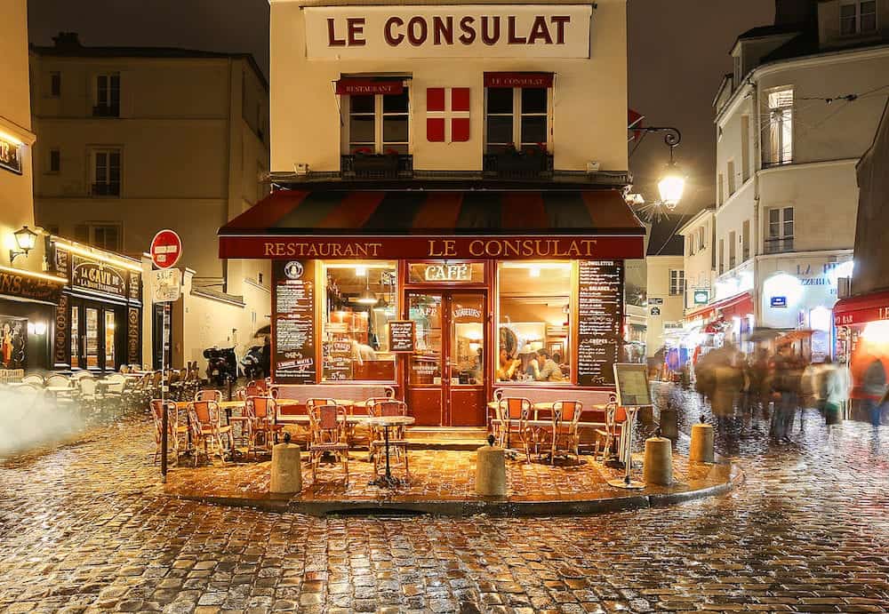 PARIS , France- View of typical paris cafe in Paris. Montmartre area is among most popular destinations in Paris, Le Consulat is a typical cafe.