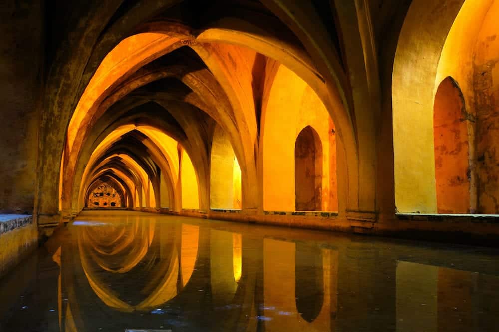 Royal baths at the Alcazar of Sevilla Spain with reflections