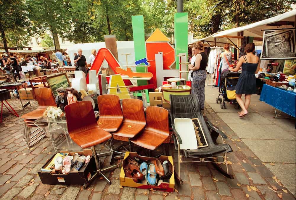 BERLIN, GERMANY -: Retro stuff furniture and utensils on sale of popular flea market. Urban area of Berlin comprised 4 mill. people 7th most populous in EU