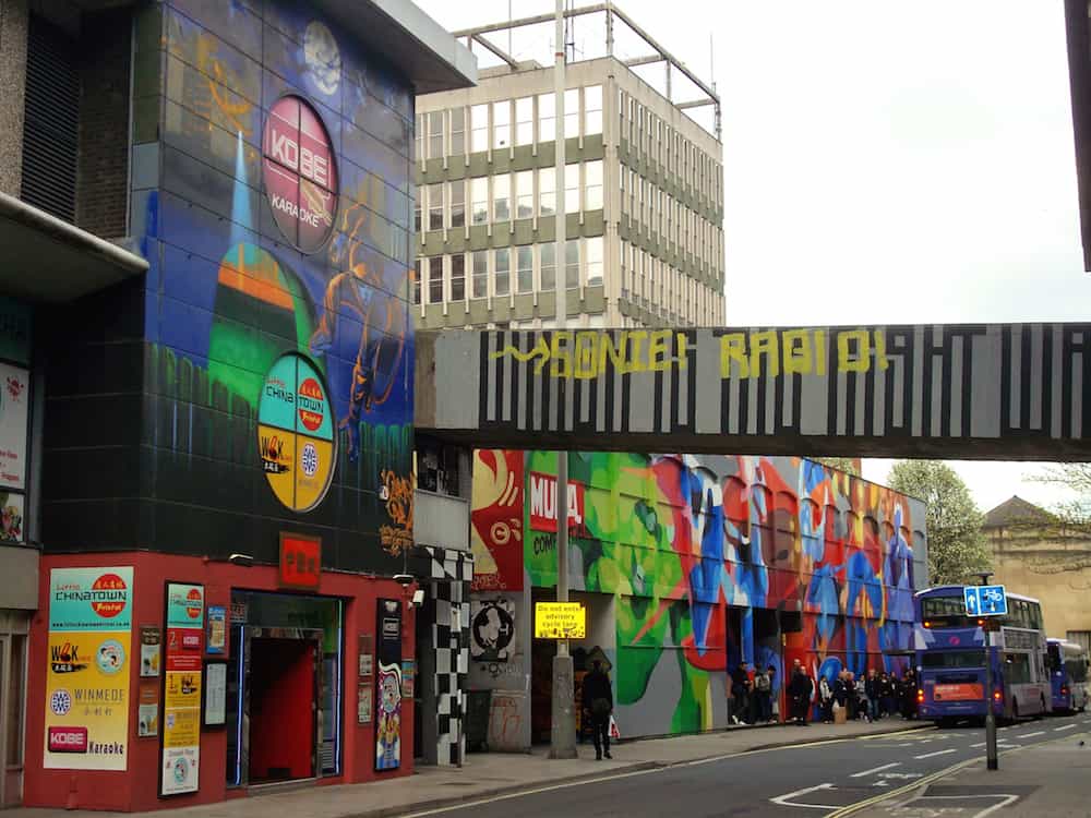 Bristol Uk - Artwork bellow an office block in Nelson Street and covering a chinese restaurant in central Bristol. Part of the See No Evil graffiti project in Bristol Britain's largest art project in 2011.