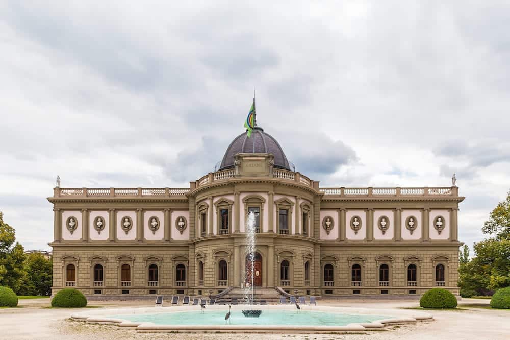 Front view of Swiss Museum of Ceramics and Glass (Museum Ariana) in Geneva Switzerland. The museum is shaped by Neo-Classical and Neo-Baroque elements and is situated on Avenue de la Paix.