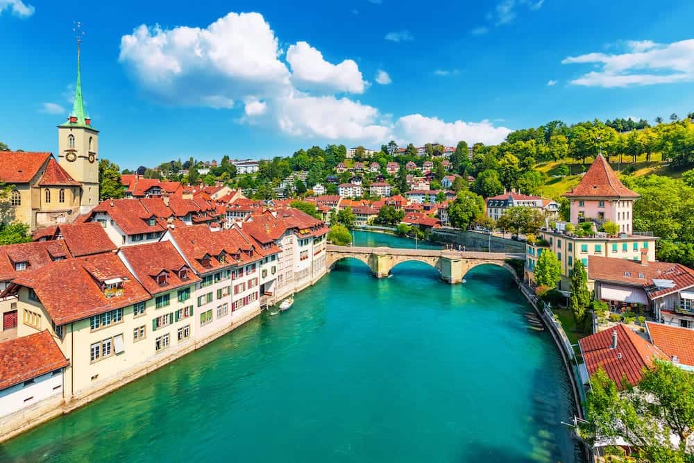 Scenic summer view of the Old Town architecture of Bern with the bridge Untertorbryukke over Aare river, Berne, Switzerland