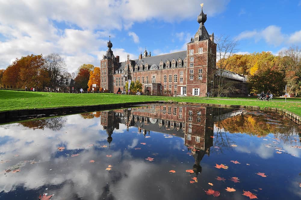 Castle reflection in autumn scenery - neo gothic castle in Heverlee, Leuven, Belgium