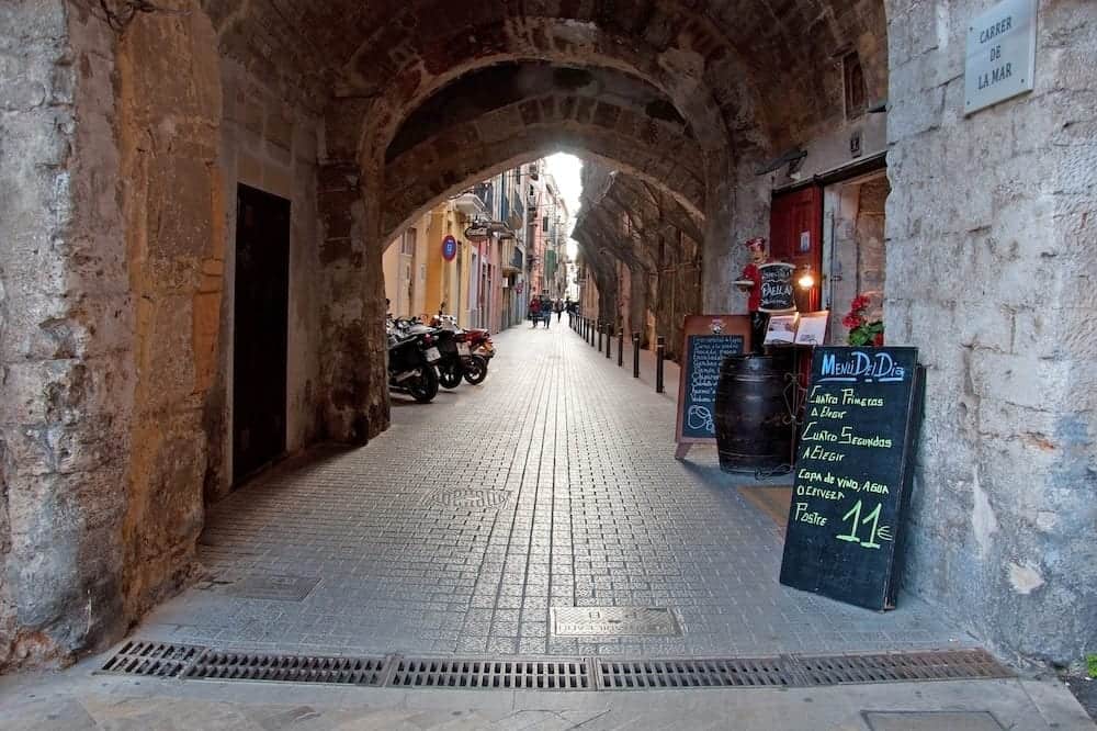 PALMA DE MALLORCA SPAIN - Palma alley restaurant. Restaurant offer of Menu del dia in an alley in Palma de Mallorca Spain.