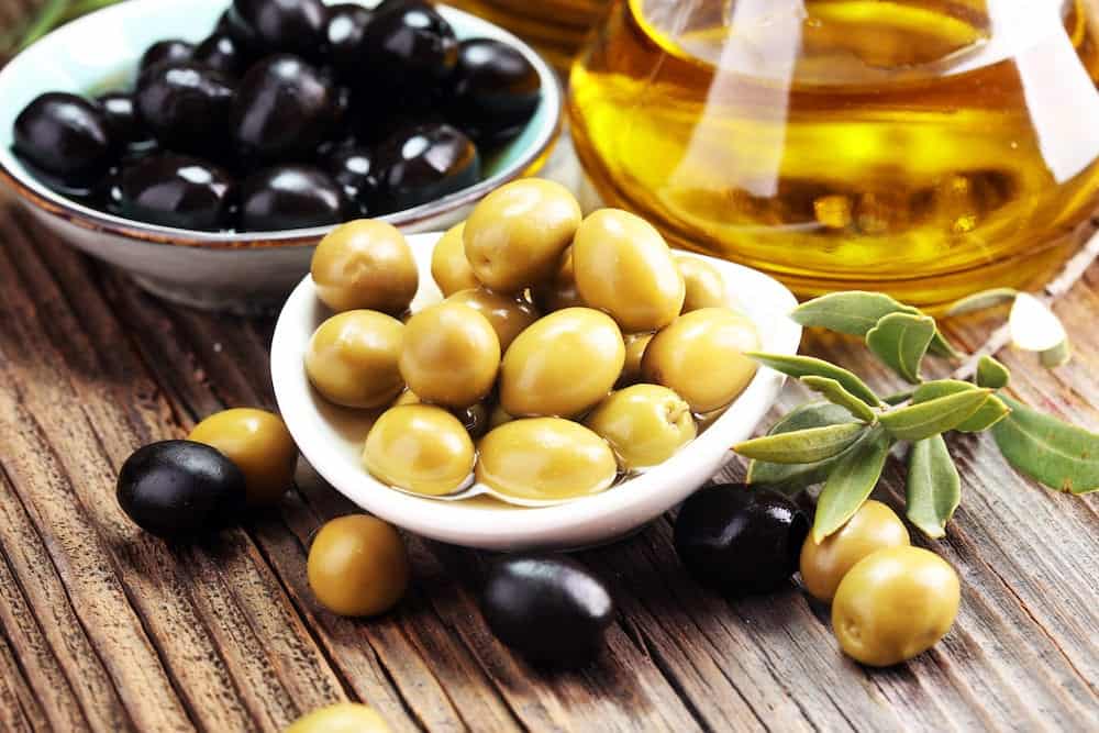 olives and olive oil. fresh organic black and green olives