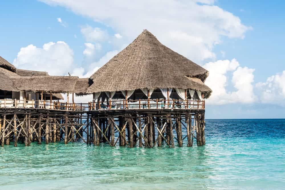 colorful landscape with african hotel in sea on the pier, Zanzibar