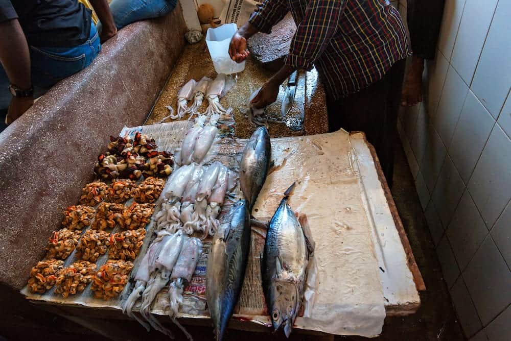 STONE TOWN, ZANZIBAR  Local people selling sea food in fish market