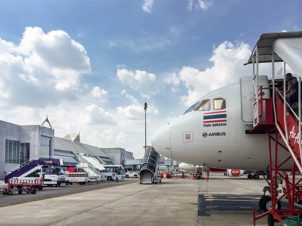 KRABI THAILAND - Passengers is getting on a Thai Air Asia plane at Krabi International Airport in Krabi Thailand.