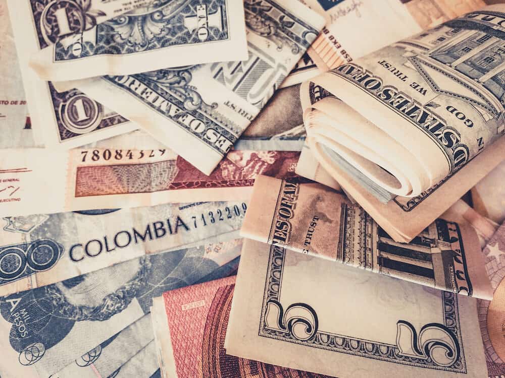 Cash money US Dollars and Colombian Pesos