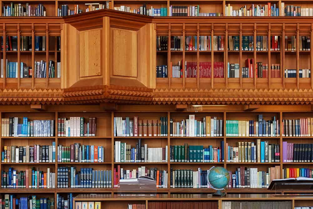 LEUVEN, BELGIUM - Wooden bookshelves in the historical library of the Catholic University in Leuven. The library is National treasure of Belgium since 1987.