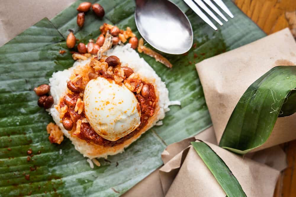 Simple authentic nasi lemak wrapped in banana leaf, popular breakfast in Malaysia