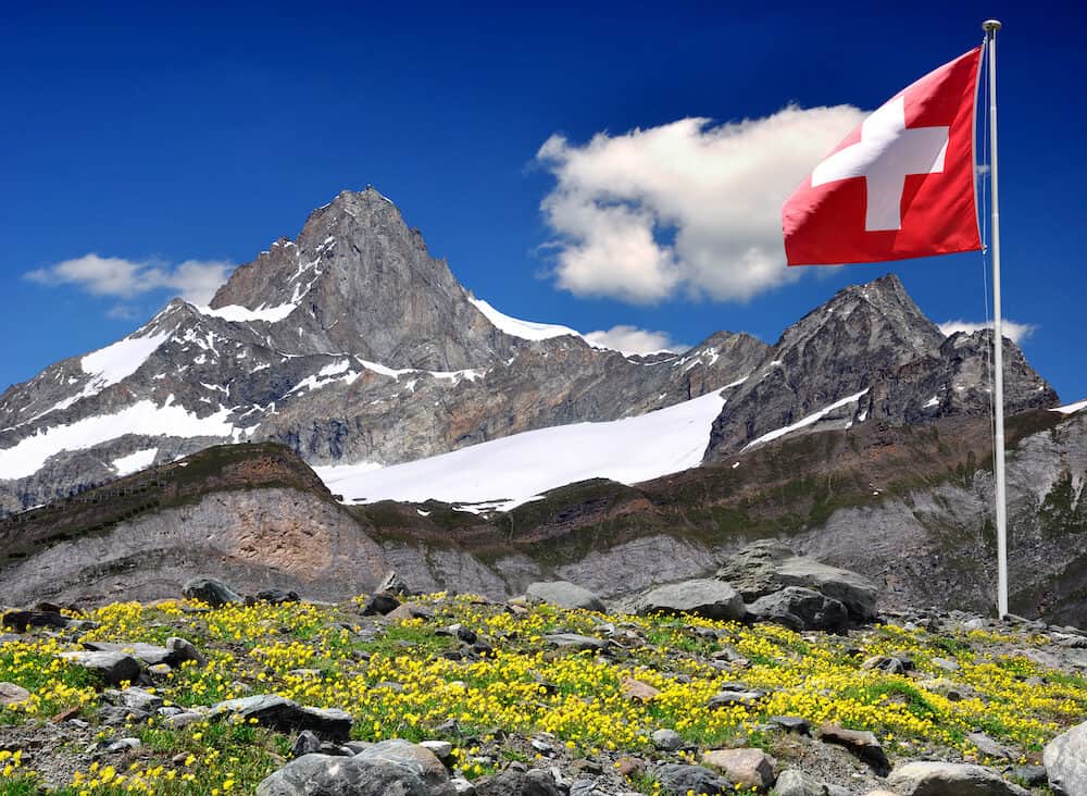 Beautiful mountain Zinalrothorn with Swiss flag - Swiss Alps