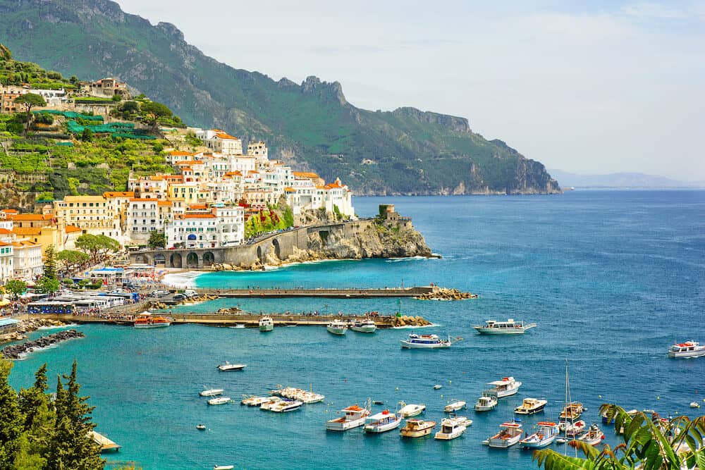 beautiful view of Amalfi town on Amalfi coast with yachts and boats Campania Italy