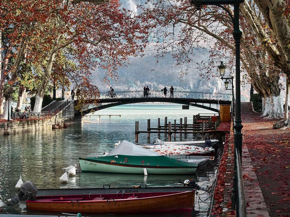 Annecy, France - : Shot of the beautiful Canal du Vassè which brings to the romantic Pont de Amours in Annecy, France. The canal is full of boats. The shot is taken in autumnal season