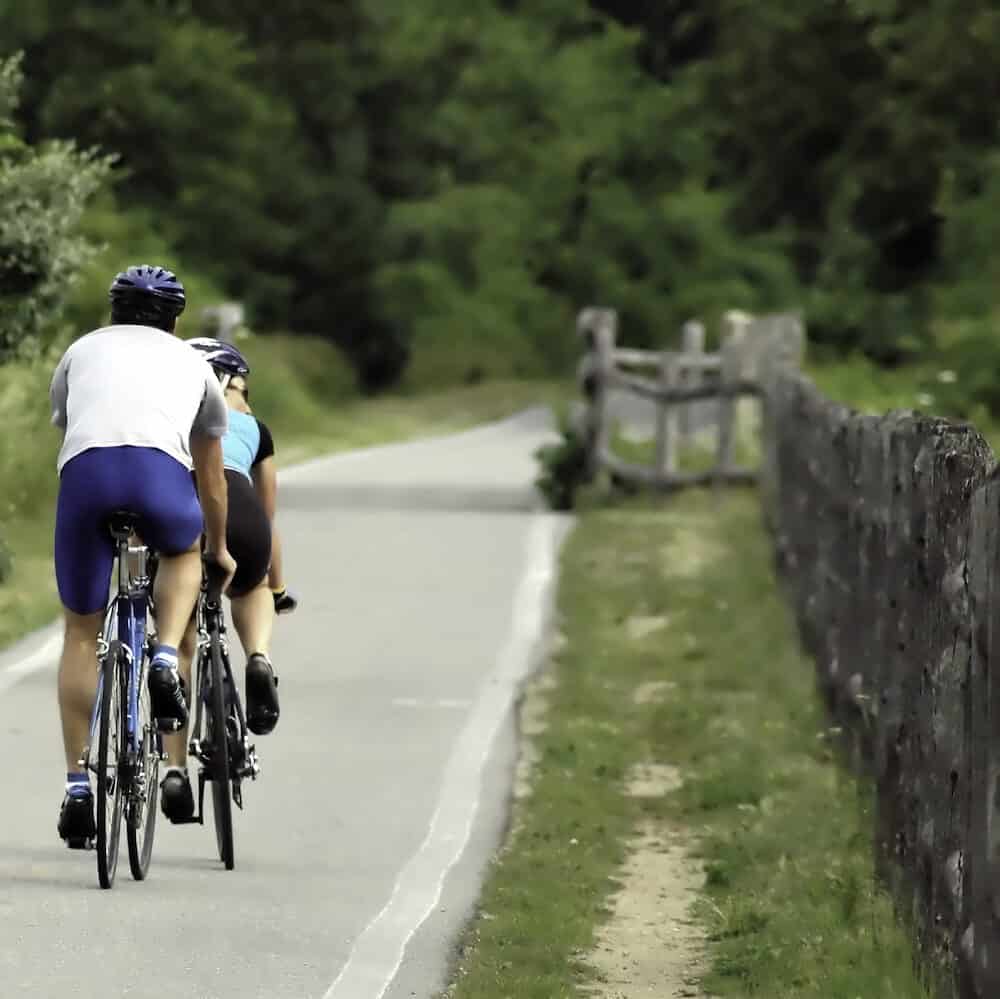 Bicyclists on the East Bay Bike Path in Bristol RI USA