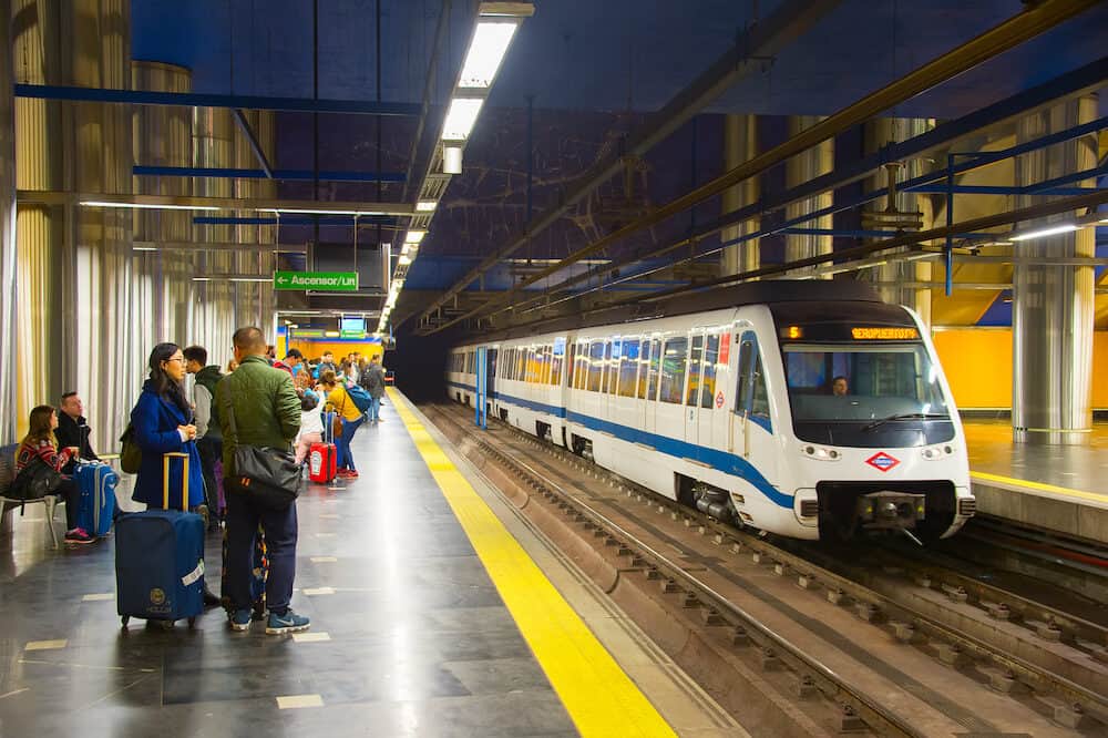 MADRID SPAIN - : Metro train arrives at Madrid metro platform. The Madrid Metro is a metro system serving the city of Madrid 7th longest metro in the world with total length of 293 km