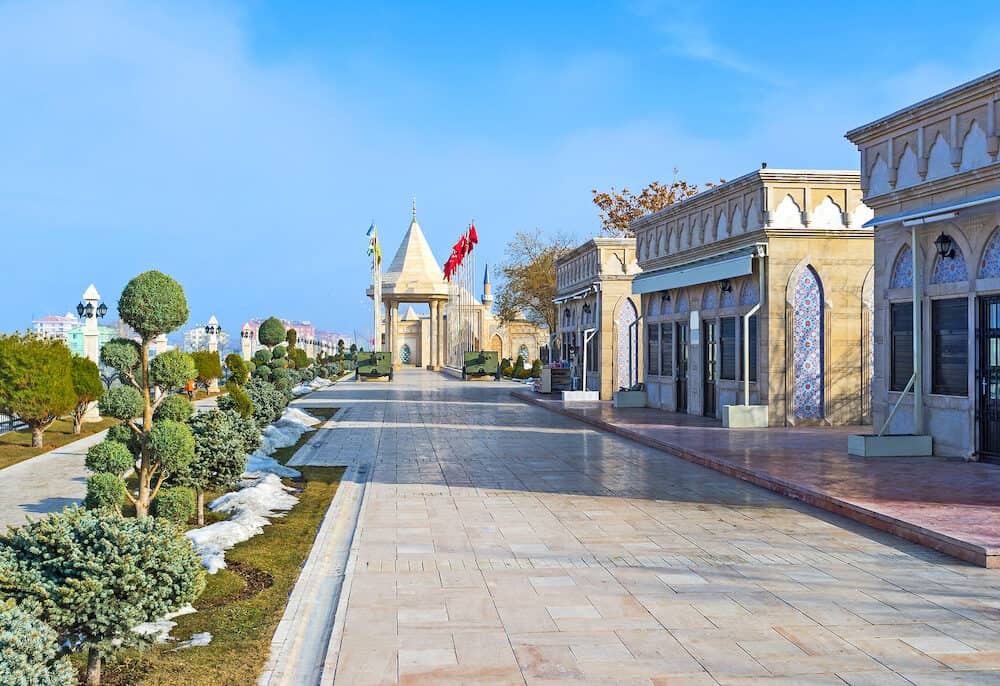 The modern street leads to the Independence War Museum surrounded by the scenic flower beds Konya Turkey.